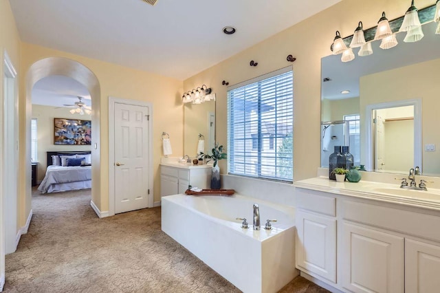 3824 Gaines Ct, Austin, TX 78735 - ensuite bathroom featuring plenty of natural light, vanity, a garden tub, and an enclosed shower