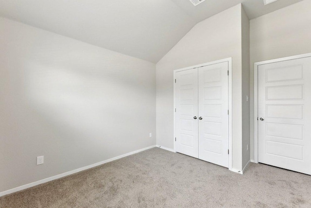 116 Saranac Dr, Elgin, TX 78621 - unfurnished bedroom featuring carpet flooring, lofted ceiling, baseboards, and a closet