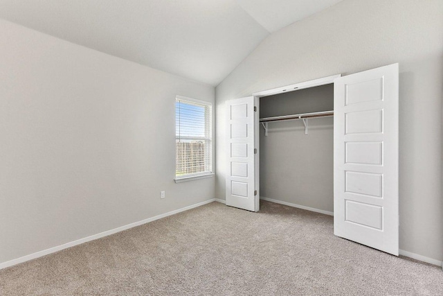 116 Saranac Dr, Elgin, TX 78621 - unfurnished bedroom featuring lofted ceiling, carpet, baseboards, and a closet