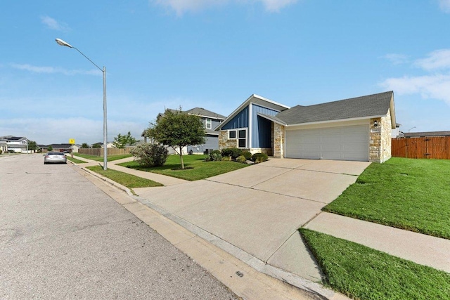 116 Saranac Dr, Elgin, TX 78621 - mid-century home with stone siding, a garage, concrete driveway, and board and batten siding