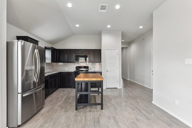 116 Saranac Dr, Elgin, TX 78621 - kitchen with black appliances, light countertops, tasteful backsplash, baseboards, and light wood-style flooring