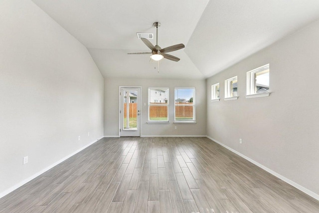 116 Saranac Dr, Elgin, TX 78621 - unfurnished room featuring ceiling fan, vaulted ceiling, wood finished floors, and baseboards