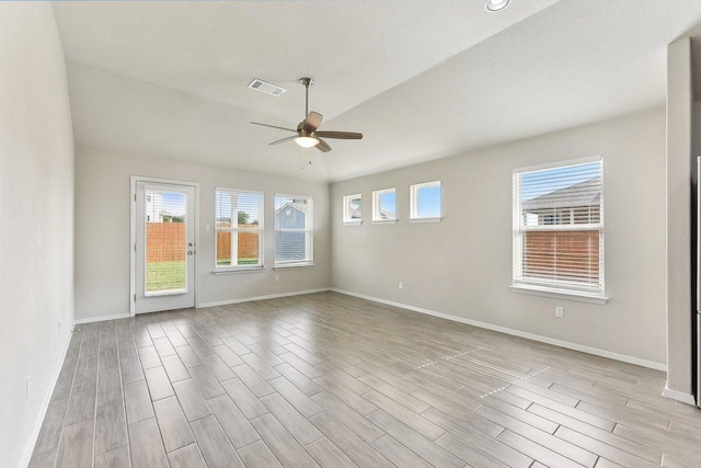 116 Saranac Dr, Elgin, TX 78621 - spare room featuring a ceiling fan, light wood-type flooring, baseboards, and lofted ceiling