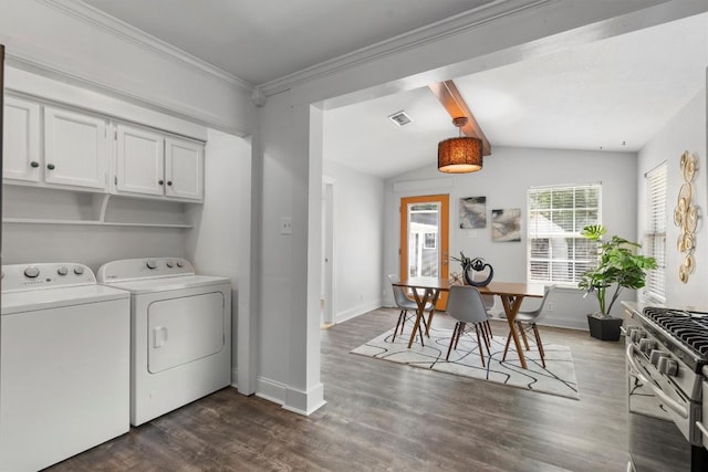1125 Christie Dr, Austin, TX 78721 - washroom with washing machine and clothes dryer and dark wood-style flooring