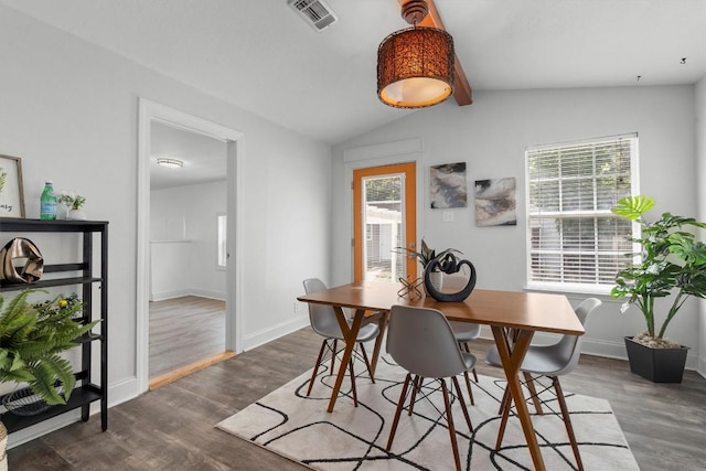 1125 Christie Dr, Austin, TX 78721 - dining area featuring plenty of natural light, dark wood-style floors, and baseboards