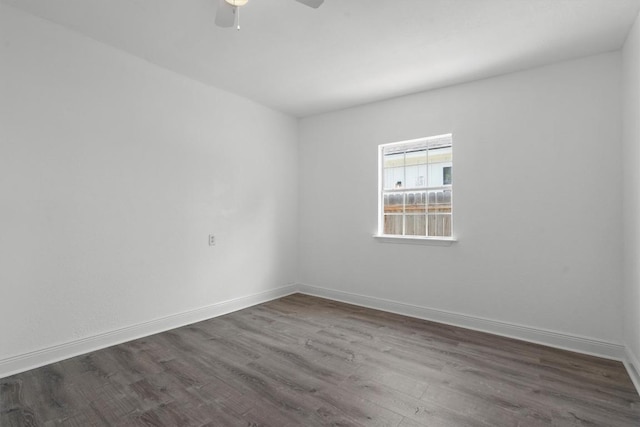 1125 Christie Dr, Austin, TX 78721 - spare room with dark wood-style floors, ceiling fan, and baseboards