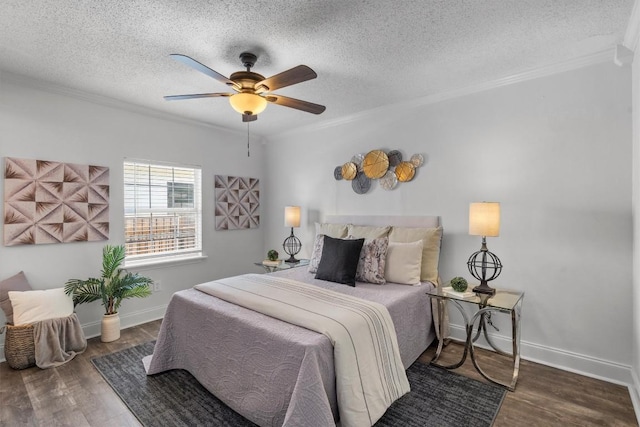 1125 Christie Dr, Austin, TX 78721 - bedroom featuring crown molding, wood finished floors, a textured ceiling, and ceiling fan