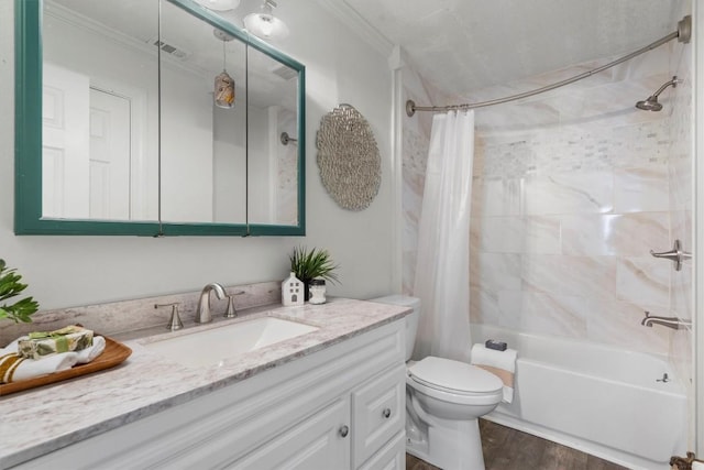 1125 Christie Dr, Austin, TX 78721 - bathroom featuring vanity, shower / bath combo, wood finished floors, toilet, and crown molding
