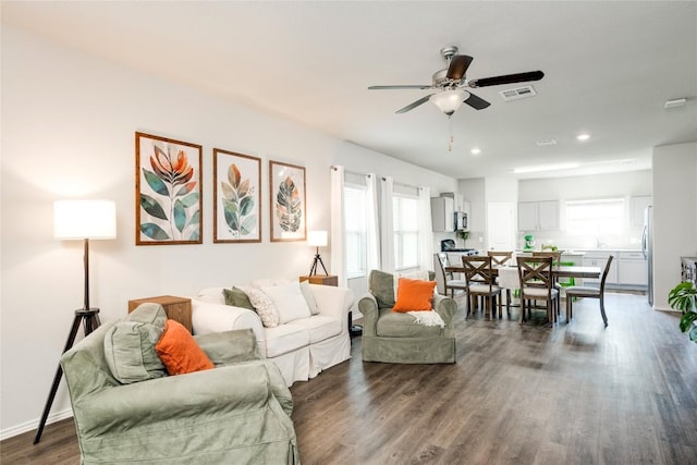 10701 Dimitrios Dr, Austin, TX 78747 - living area with ceiling fan, dark wood-style floors, and recessed lighting