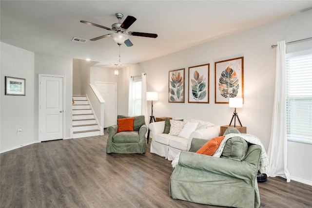 10701 Dimitrios Dr, Austin, TX 78747 - living area with wood finished floors, stairs, and a ceiling fan