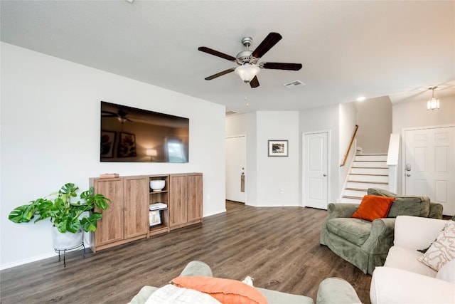 10701 Dimitrios Dr, Austin, TX 78747 - living room featuring a ceiling fan, dark wood-style flooring, and stairs