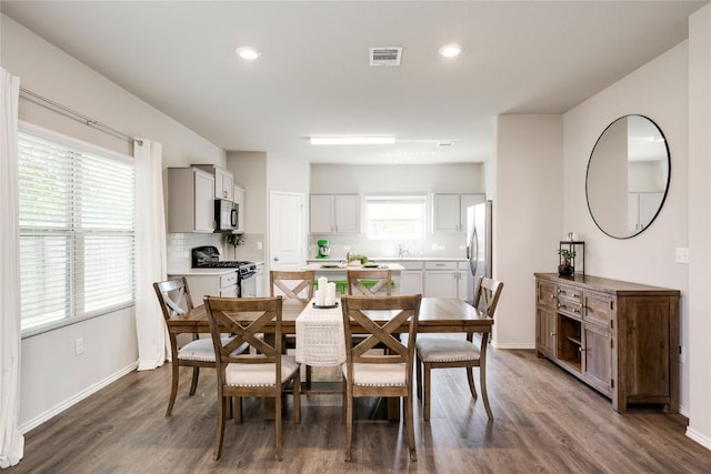 10701 Dimitrios Dr, Austin, TX 78747 - dining area featuring wood finished floors and recessed lighting