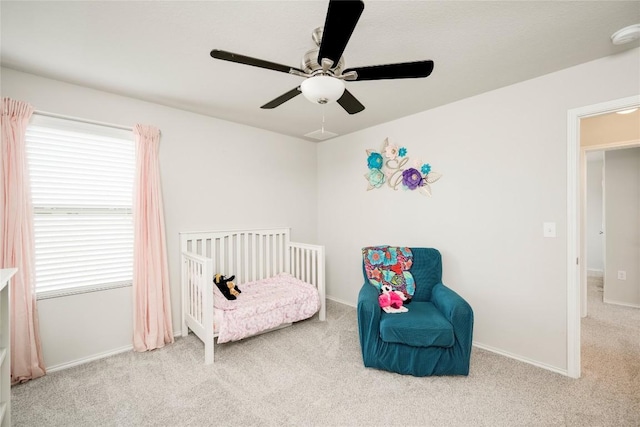 10701 Dimitrios Dr, Austin, TX 78747 - carpeted bedroom with multiple windows, a crib, and a ceiling fan