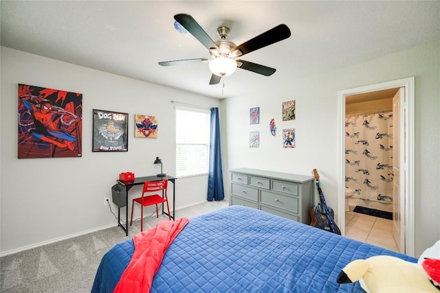 10701 Dimitrios Dr, Austin, TX 78747 - bedroom with ensuite bathroom, a ceiling fan, and light carpet