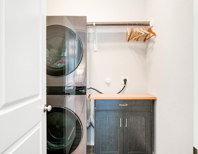 10701 Dimitrios Dr, Austin, TX 78747 - washroom with stacked washing machine and dryer