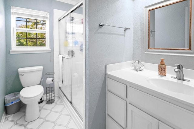 731 Verna Lee Blvd, Harker Heights, TX 76548 - full bathroom with vanity, toilet, a stall shower, a textured wall, and tile patterned floors