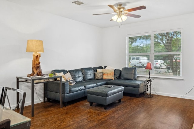 6412 Circulo De Amistad, Austin, TX 78741 - living room featuring ceiling fan, wood finished floors, and baseboards