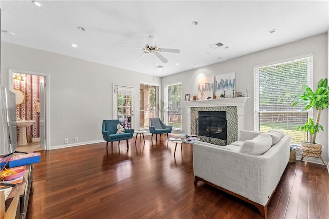 5357 Austral Loop, Austin, TX 78739 - living area with a ceiling fan, wood finished floors, a tiled fireplace, plenty of natural light, and recessed lighting