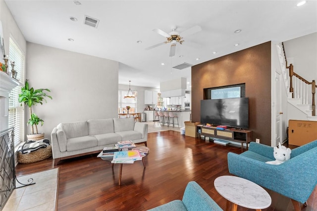 5357 Austral Loop, Austin, TX 78739 - living room featuring stairway, wood finished floors, a ceiling fan, and recessed lighting