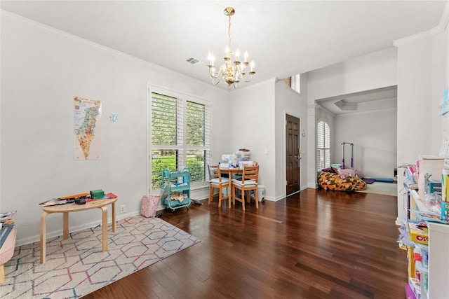 5357 Austral Loop, Austin, TX 78739 - dining space with a chandelier, plenty of natural light, ornamental molding, and wood finished floors