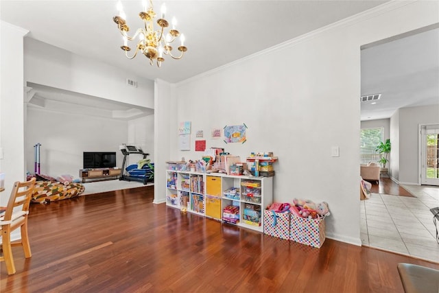 5357 Austral Loop, Austin, TX 78739 - rec room with a chandelier, wood finished floors, and ornamental molding