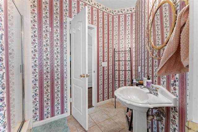 5357 Austral Loop, Austin, TX 78739 - bathroom with wallpapered walls, a stall shower, tile patterned flooring, and baseboards