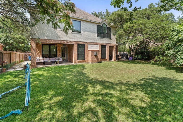 5357 Austral Loop, Austin, TX 78739 - rear view of house with an outdoor hangout area, brick siding, a patio, and roof with shingles