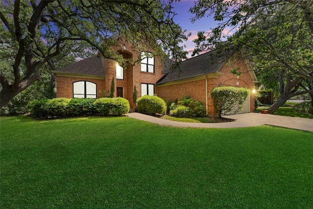 5357 Austral Loop, Austin, TX 78739 - traditional home with a lawn, brick siding, a garage, a shingled roof, and concrete driveway