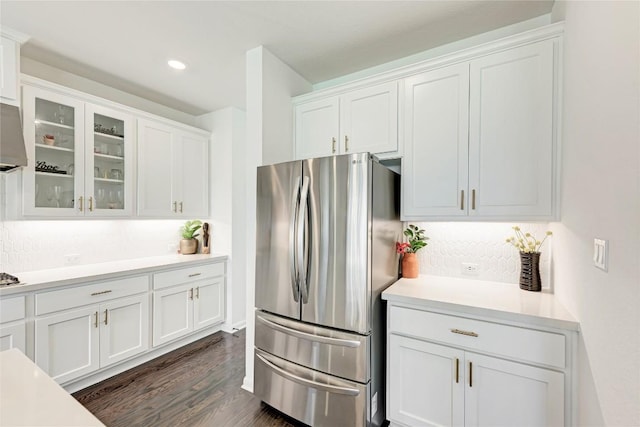 5028 Olimpico Way, Leander, TX 78641 - kitchen featuring freestanding refrigerator, white cabinets, light countertops, glass insert cabinets, and dark wood-type flooring