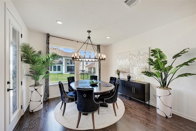 5028 Olimpico Way, Leander, TX 78641 - dining space featuring a chandelier, dark wood-type flooring, and recessed lighting