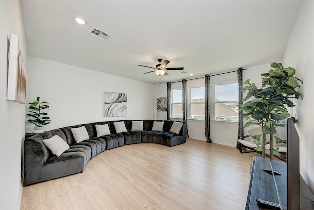 5028 Olimpico Way, Leander, TX 78641 - living area with wood finished floors, ceiling fan, baseboards, and recessed lighting