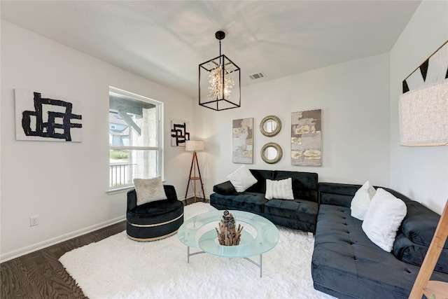5028 Olimpico Way, Leander, TX 78641 - living room featuring a chandelier, wood finished floors, and baseboards