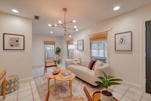 2010 Alguno Rd, Austin, TX 78757 - living room with light tile patterned floors, a chandelier, and recessed lighting