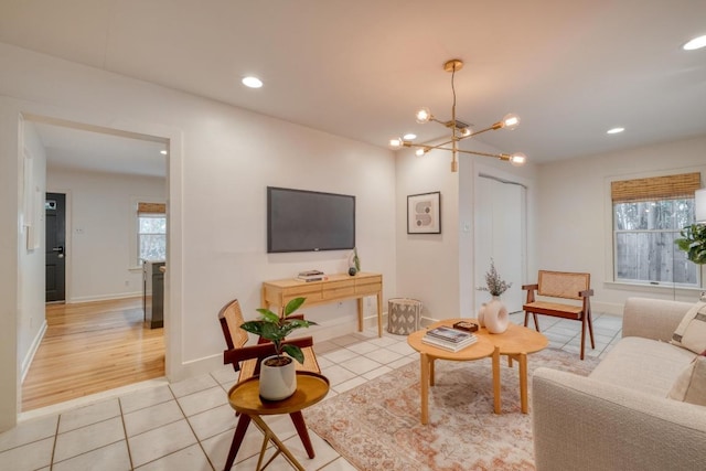 2010 Alguno Rd, Austin, TX 78757 - living room with light tile patterned floors, a chandelier, recessed lighting, and baseboards