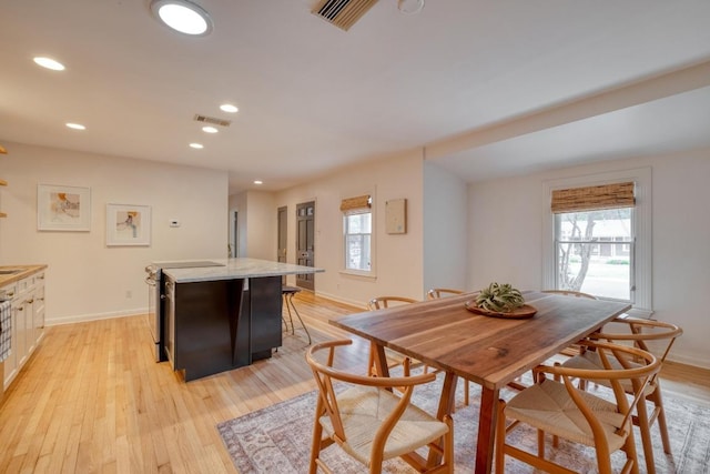 2010 Alguno Rd, Austin, TX 78757 - dining space with light wood-style flooring, recessed lighting, and baseboards