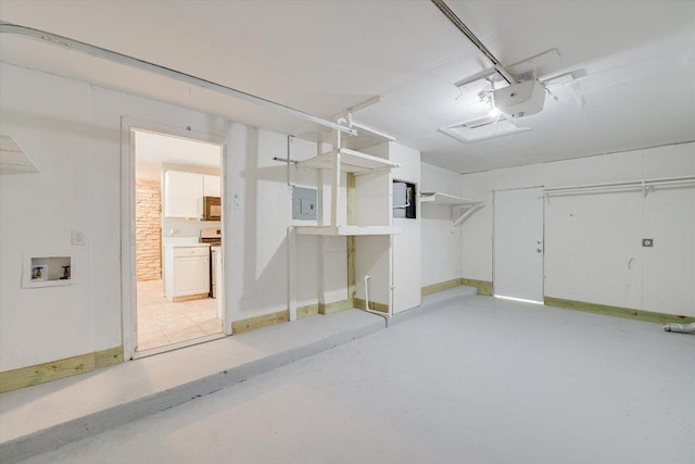 8711 Bridgeport Dr, Austin, TX 78758 - garage with electric panel and a garage door opener