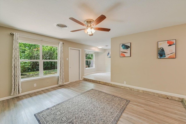 8711 Bridgeport Dr, Austin, TX 78758 - entrance foyer featuring wood finished floors, ceiling fan, and baseboards