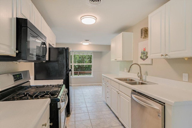8711 Bridgeport Dr, Austin, TX 78758 - kitchen featuring stainless steel appliances, a sink, white cabinets, and light countertops