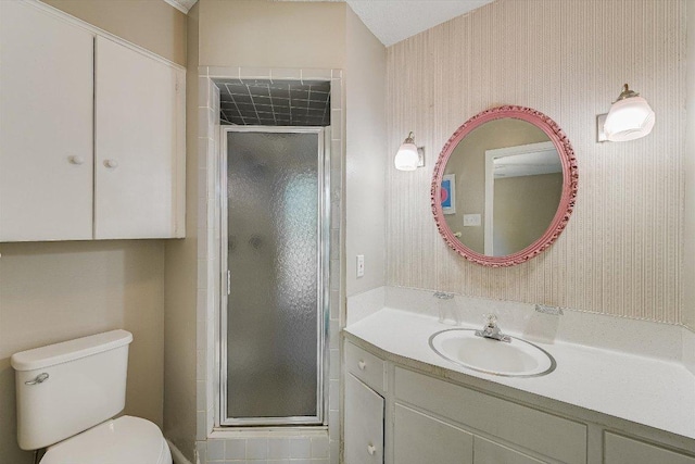 8711 Bridgeport Dr, Austin, TX 78758 - full bath with a stall shower, vanity, toilet, and wallpapered walls