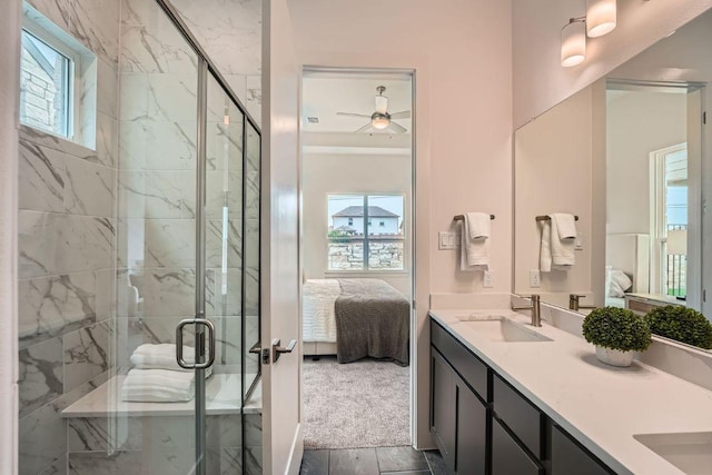 1531 N Red Bud Ln Unit 34, Round Rock, TX 78665 - ensuite bathroom with double vanity, plenty of natural light, a marble finish shower, and a ceiling fan