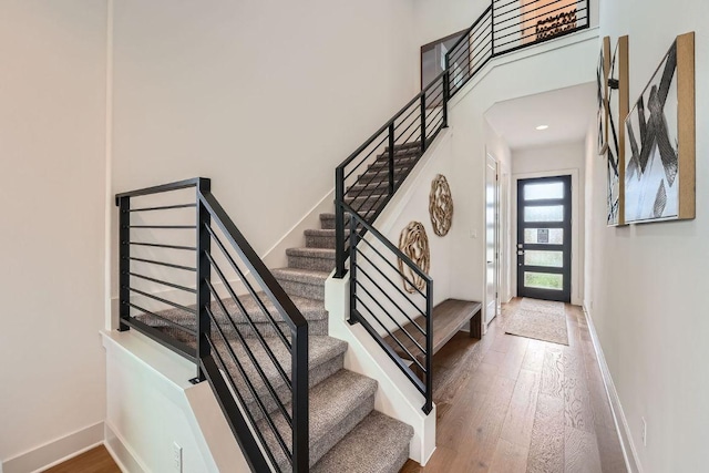 1531 N Red Bud Ln Unit 34, Round Rock, TX 78665 - entryway with wood finished floors and stairs