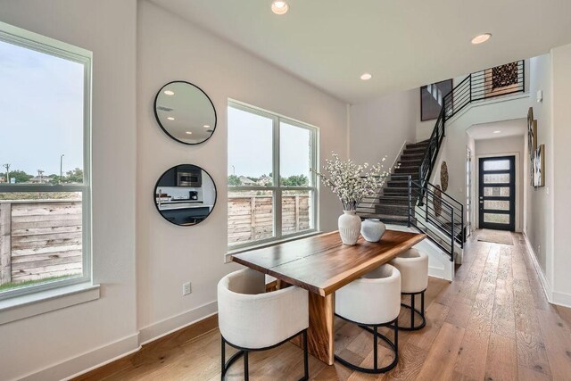 1531 N Red Bud Ln Unit 34, Round Rock, TX 78665 - dining area featuring wood finished floors, recessed lighting, and stairs