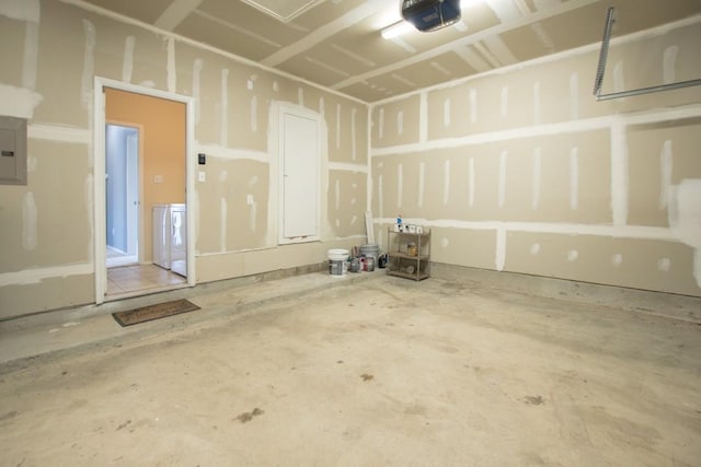 564 Moonwalker Trl, Buda, TX 78610 - garage featuring a garage door opener and electric panel