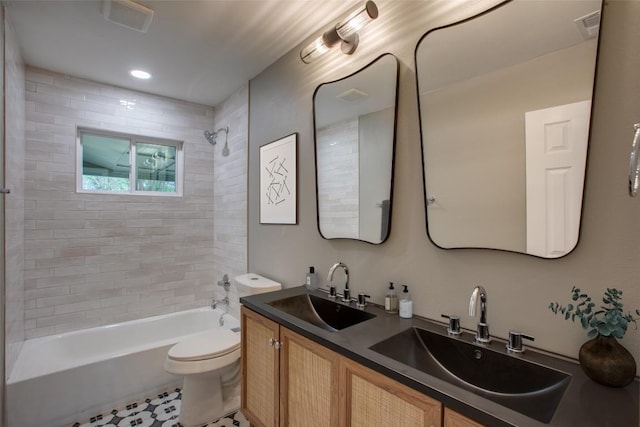 5507 Gloucester Ln, Austin, TX 78723 - full bathroom with shower / bath combination, double vanity, and tile patterned floors