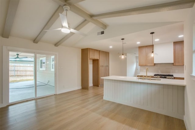 5507 Gloucester Ln, Austin, TX 78723 - kitchen with ceiling fan, recessed lighting, light wood-type flooring, light countertops, and backsplash