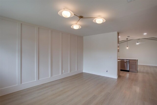 5507 Gloucester Ln, Austin, TX 78723 - spare room featuring a decorative wall and light wood-type flooring