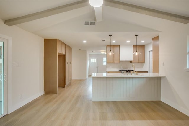 5507 Gloucester Ln, Austin, TX 78723 - kitchen with light wood-style flooring, light countertops, a peninsula, recessed lighting, and ceiling fan