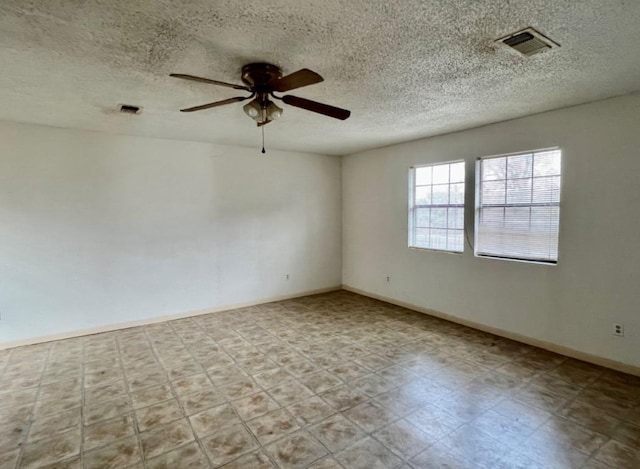 10208 Thomaswood Ln, Austin, TX 78736 - empty room featuring a ceiling fan, a textured ceiling, baseboards, and tile patterned floors