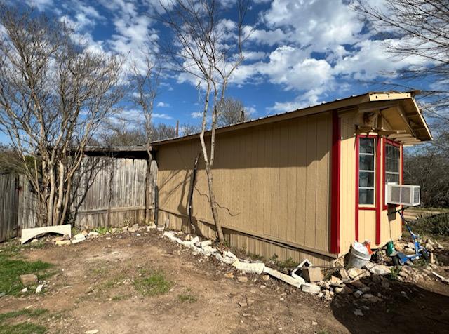 10208 Thomaswood Ln, Austin, TX 78736 - view of home's exterior with an outbuilding and cooling unit