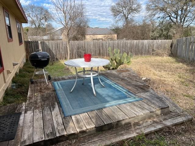 10208 Thomaswood Ln, Austin, TX 78736 - wooden deck with area for grilling and a fenced backyard